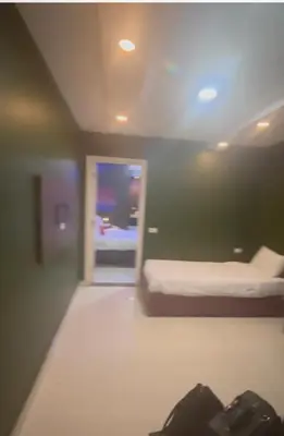 a room with a bed and a door with a window at مول بلازا in Aswān