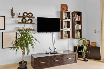 a living room with a flat screen tv on a wall at South Marina Central 2BR, bathtub, Terraces & Pool in Hurghada