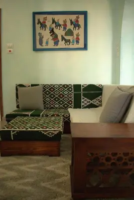 a living room with a couch and a table at 36 Southwalk in Quseir
