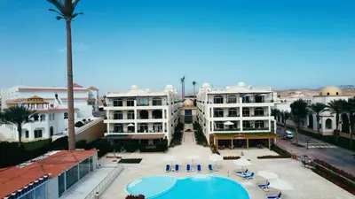 an aerial view of a resort with a swimming pool at Palm Beach Piazza Apart hotel Sahl Hasheesh Hurghada in Hurghada