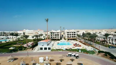 a view of a resort with a pool and buildings at Palm Beach Piazza Apart hotel Sahl Hasheesh Hurghada in Hurghada