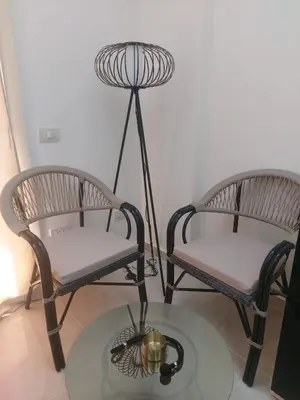 a room with two chairs and a table with a orb at Tiba golden resort in Hurghada