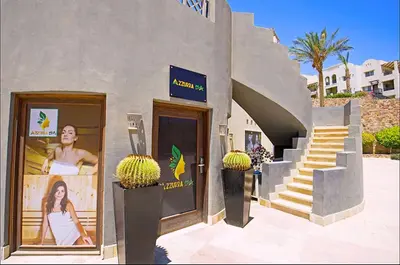 a building with a sign on the side of it at Luxury Apartment In Azzurra Sahl Hashish 6G101 in Hurghada
