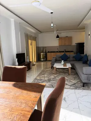 a living room with a couch and a table at Al Baba II Nile Villa in Luxor