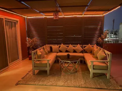 a living room with a couch and a table at Private Rooftop Two Bedroom SeaView Panorama in Hurghada