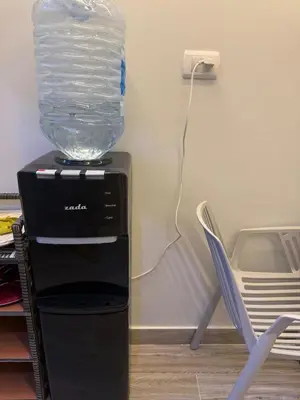 a bottle of water is sitting on top of a machine at Private Rooftop Two Bedroom SeaView Panorama in Hurghada