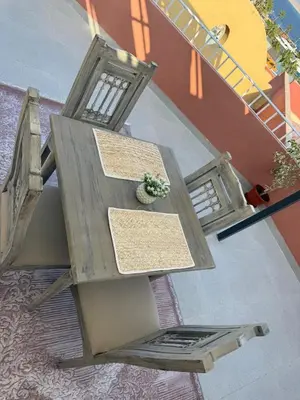 a wooden table with a potted plant on top of it at Private Rooftop Two Bedroom SeaView Panorama in Hurghada