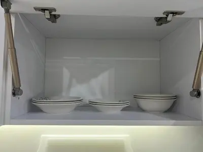 three bowls on a shelf in a white room at Sea view studio for rent at Juliana at Hurghada in Hurghada