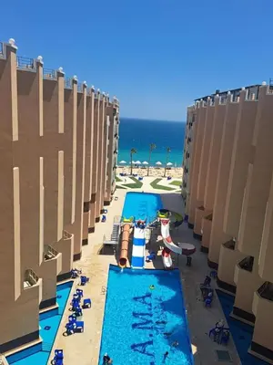 an overhead view of a pool at the beach at Sea view studio for rent at Juliana at Hurghada in Hurghada