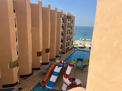 a pool at a hotel with a water slide at Sea view studio for rent at Juliana at Hurghada in Hurghada