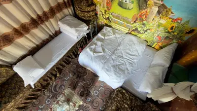 an overhead view of a bed with white sheets and pillows at Safeya Kato in Jazīrat ‘Awwāḑ