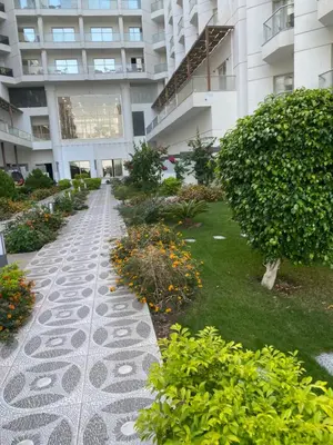a garden in front of a building at Hurghada scandic resort in Hurghada