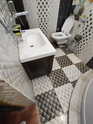 a bathroom with a sink and a toilet at شقة بمول اسوان بلازا- اسوان in Aswān