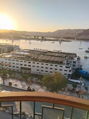 a view of a marina with a cruise ship at شقة بمول اسوان بلازا- اسوان in Aswān