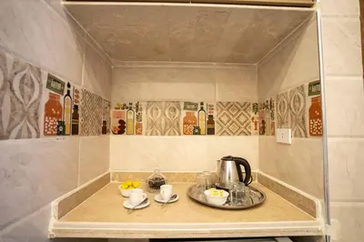 a kitchen counter with a tea kettle on it at Theban Hills Hotel, Luxor in ‘Ezbet Abu Ḥabashi