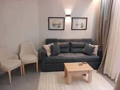 a living room with a couch and a coffee table at فندق ومنتجع سكاندك in Hurghada