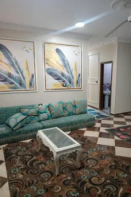 a living room with a couch and a coffee table at المحكمة in Aswan