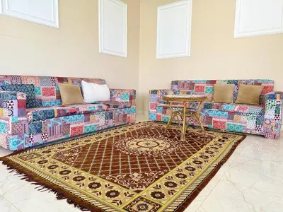 a living room with two couches and a table at Citadel Luxor in Luxor