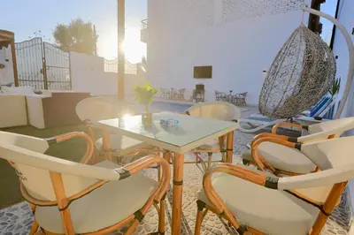 a table and chairs in a room with a table at White Gorf Hotel in Luxor