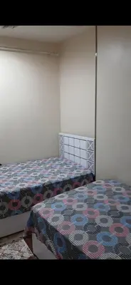 a bedroom with two beds in a room at قصر الحجر in Aswan