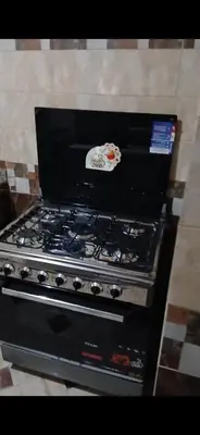 a black stove top oven sitting in a kitchen at قصر الحجر in Aswan