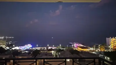 a view of a city at night at ROOF TOP 12 Seaview in Hurghada