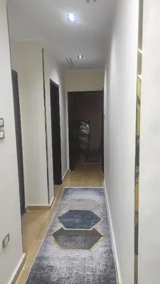 an empty hallway with a rug on the floor at Nice flat in region Intercontinental in Hurghada
