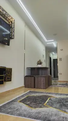 a large room with a table and a wall at Nice flat in region Intercontinental in Hurghada