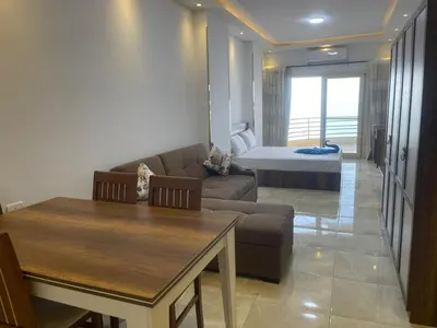 a living room with a couch and a bed at مصر in Hurghada