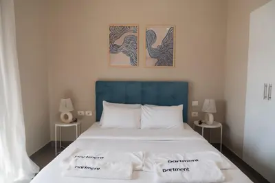 a bedroom with a bed with two towels on it at Spacious Lagoon View Villa At Joubal in Hurghada