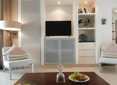 a living room with a tv and a table at Unique cozy villa sea view in Hurghada
