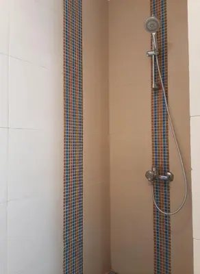 a shower with a shower head in a bathroom at Unique cozy villa sea view in Hurghada