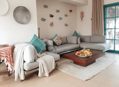 a living room with a couch and a table at Unique cozy villa sea view in Hurghada