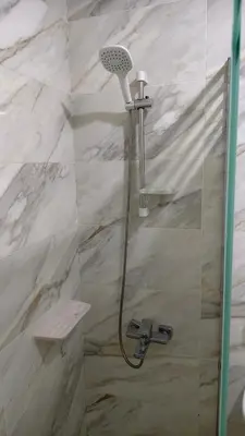 a shower with a shower head in a bathroom at Holiday appartment in Tiba Golden in Hurghada
