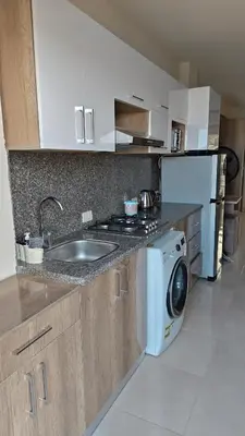 a kitchen with a sink and a washing machine at Holiday appartment in Tiba Golden in Hurghada