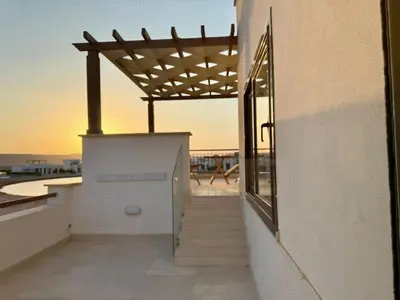 a building with awning on the side of it at Sunny 4BR Villa Plus Nanny With Private Heated Pool And Jacuzzi In ElGouna in Hurghada
