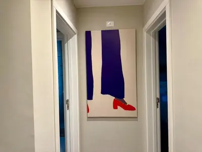 a painting of a pair of red shoes on a wall at Sunny 4BR Villa Plus Nanny With Private Heated Pool And Jacuzzi In ElGouna in Hurghada