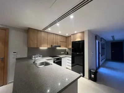 a kitchen with a sink and a black refrigerator at Ancient Hill 3BR Roof & Private Mini Pool in Hurghada