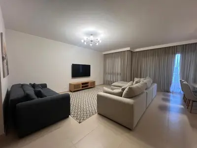 a living room with two couches and a flat screen tv at Ancient Hill 3BR Roof & Private Mini Pool in Hurghada