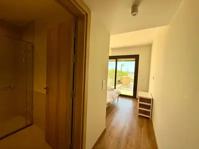 a hallway with a door to a room with a bedroom at Premium 3BR Plus Nanny Villa -Free Pool And Lagoon Access In ElGouna in Hurghada