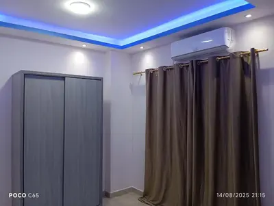 a room with curtains and a blue ceiling at Red Ruby suites& flats HRG & Elgouna in El Gouna