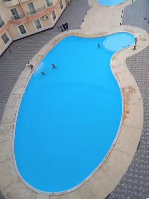 an overhead view of a large swimming pool at Red Ruby suites& flats HRG & Elgouna in El Gouna