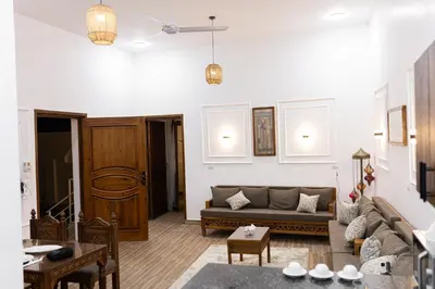 a living room with a couch and a table at Horus Garden House in Luxor