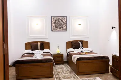 two beds sitting next to each other in a bedroom at Horus Garden House in Luxor