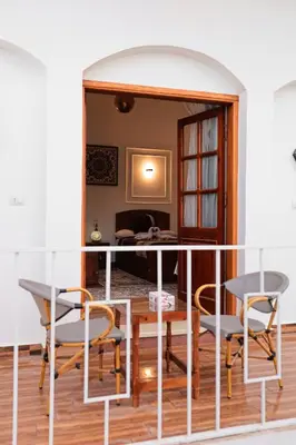 a dining room with a table and chairs at Horus Garden House in Luxor