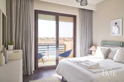a hotel room with a bed and a balcony at BYTK - La Serena in Hurghada