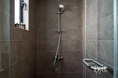 a shower with a shower head in a bathroom at BYTK - La Serena in Hurghada