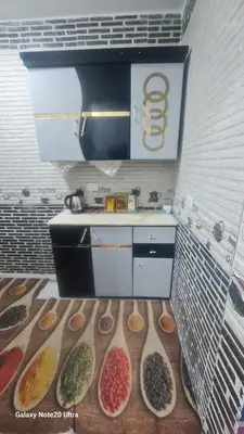 a kitchen with bowls of food on the floor at Aladino Nubian Soul in Aswan