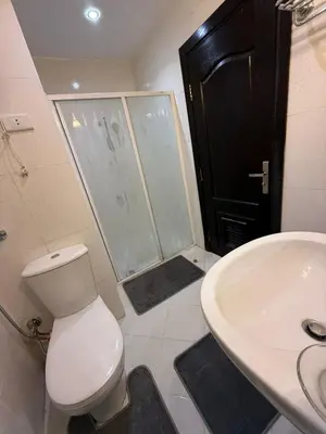 a bathroom with a toilet and a sink and a shower at Diamond resort Hurghada 7 in Hurghada