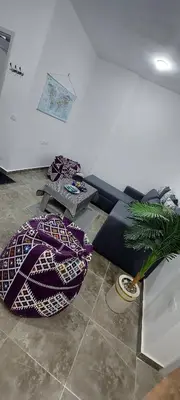 a living room with a couch and a table at Relax near the sea, one bedroom flat in Hurghada